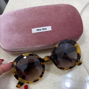 Miu Miu Tortoiseshell Sunglasses with Round Lenses